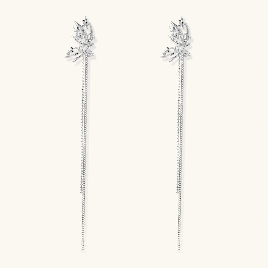 Silver-toned threader earrings featuring detailed fairy figure with wings and dual delicate chain strands, zirconia accents