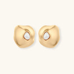 Organic-shaped eco-zinc alloy stud earrings with resin pearl centers and sterling silver posts on white background.