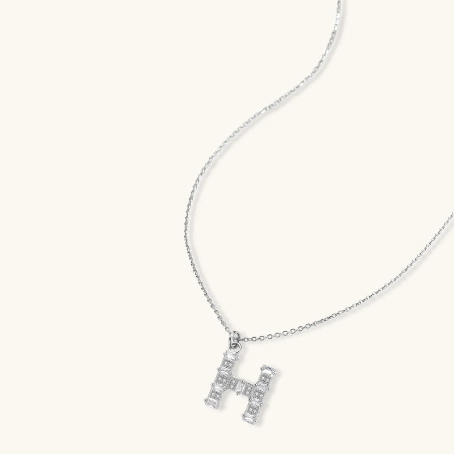 Letter H jewelry set featuring geometric crystal design in gold and white gold plated finish with adjustable chain necklace