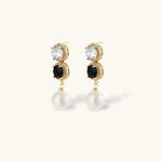 Gold-plated jewelry set with alternating black and clear cubic zirconia stones, featuring necklace, earrings and bracelet