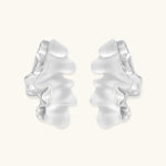 Modern sculptural jewelry set with flowing ribbon-like earrings and matching pendant in eco-zinc alloy finish