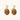 Gold-toned dangle earrings with organic brown resin stones and crystal accents on white background